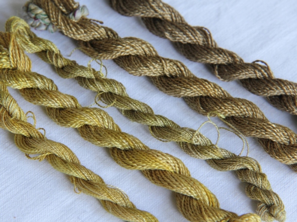 embroidery silk dyed with alchemilla mollis. From bottom left: alum, alum, alum+iron, copper, copper+ iron.